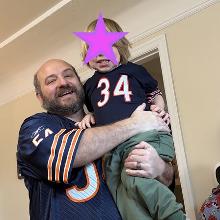 Zach holding his little one